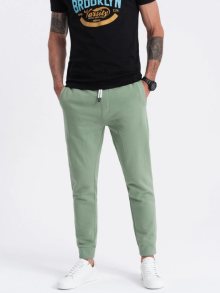 Ombre Clothing Zelené tepláky s trendy prošíváním V3 PABS-0173